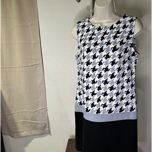 Sleeveless Dress in a hounds tooth pattern top & black skirt. Office old money.